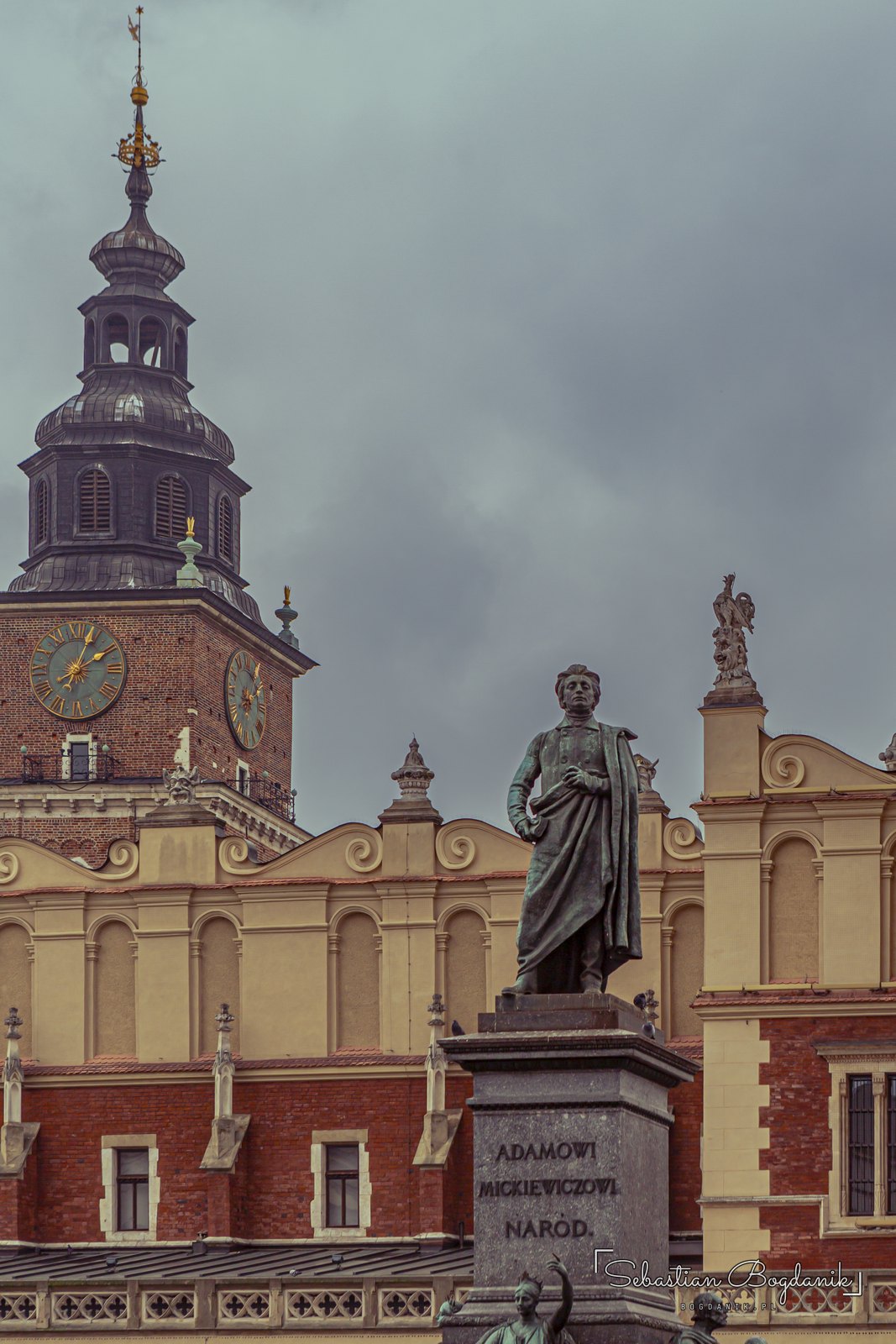 The Adam Mickiewicz Monument, on the Square since 1898, with the Town Hall Tower behind.