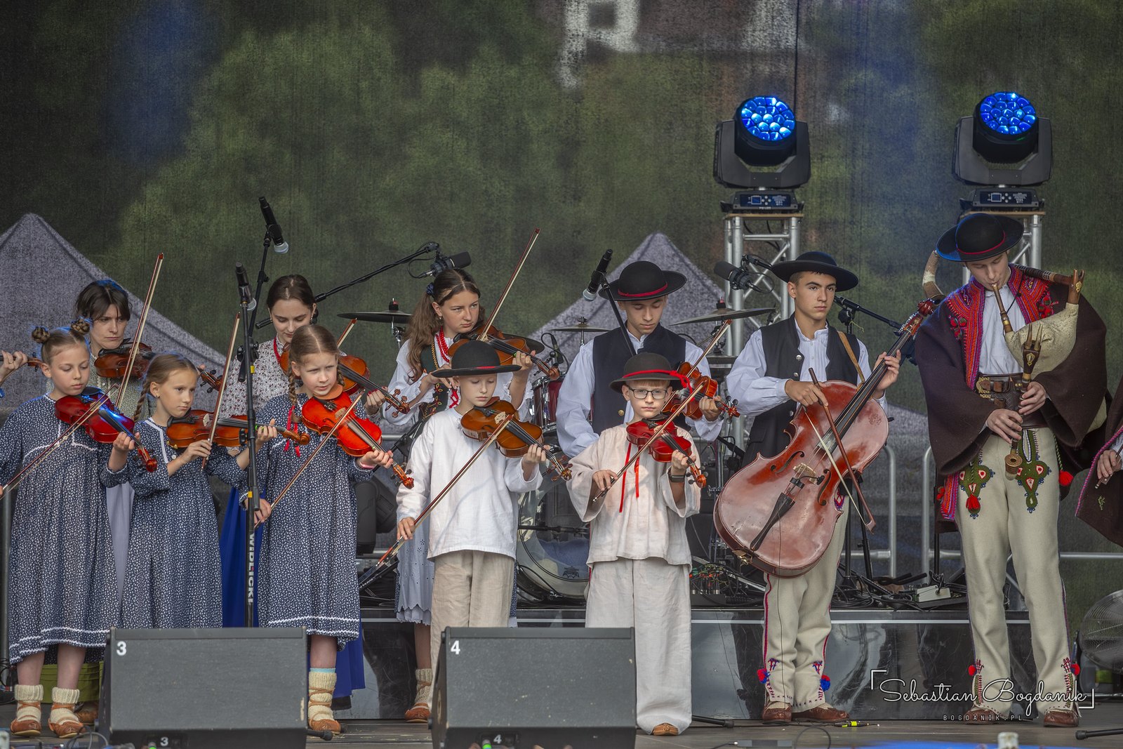 A children’s string band on stage.