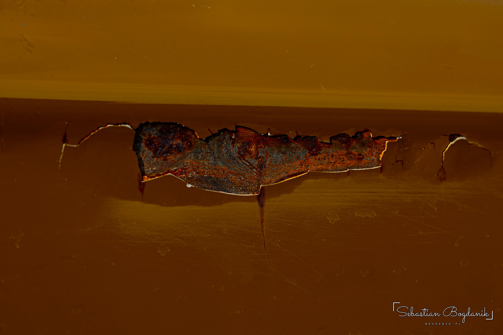 Patina, Polish style: rust blooming where a badge used to be, and the chrome vent “gills” on the rear pillar (1/2)