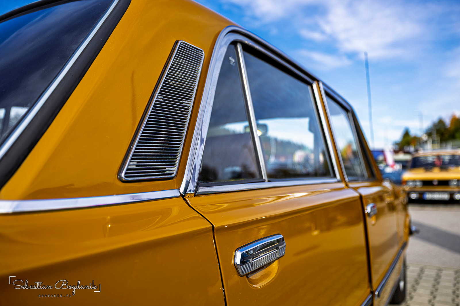 Patina, Polish style: rust blooming where a badge used to be, and the chrome vent “gills” on the rear pillar (2/2)