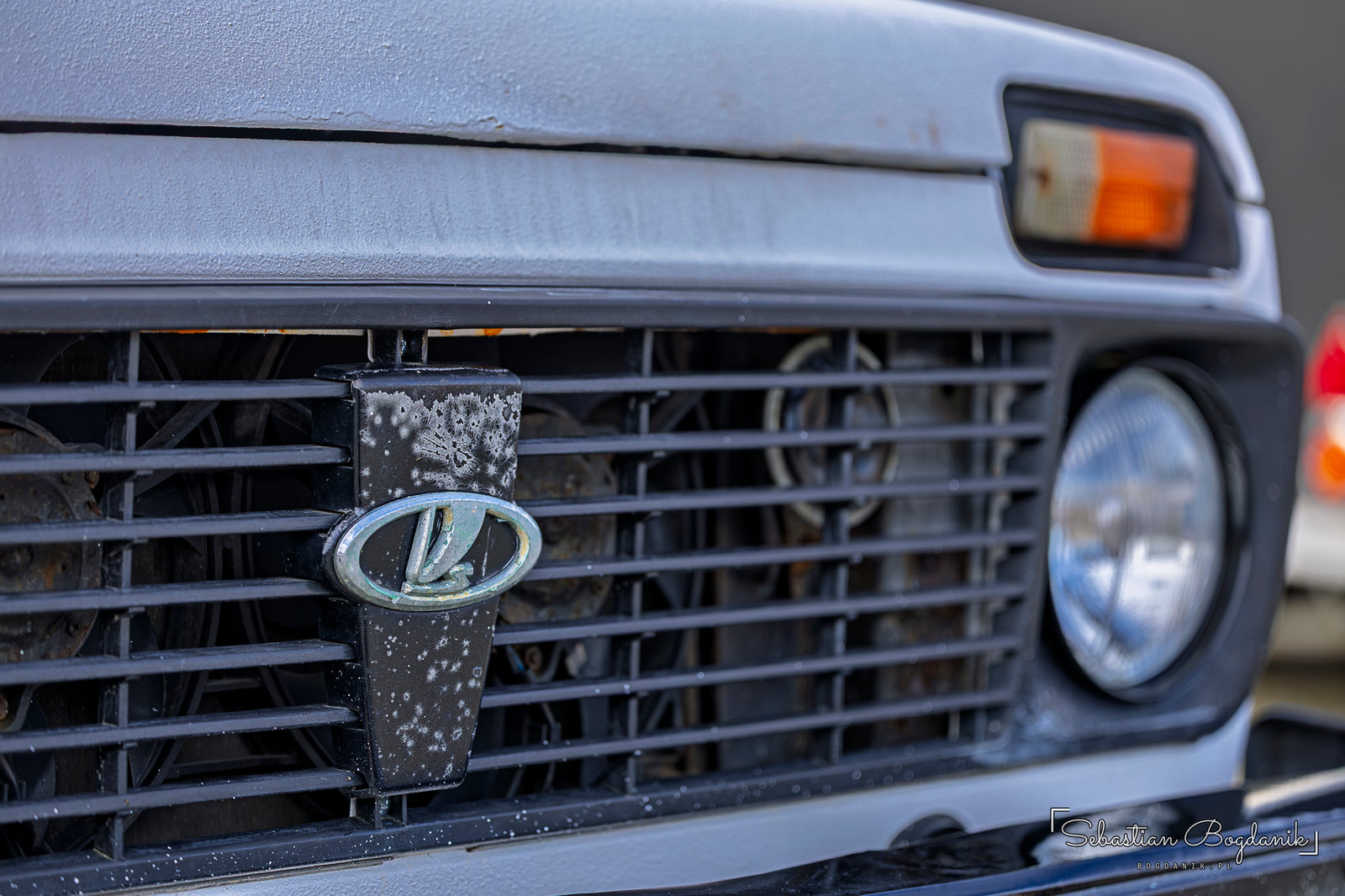 A Lada Niva on lifted suspension with bright yellow springs (1/2)