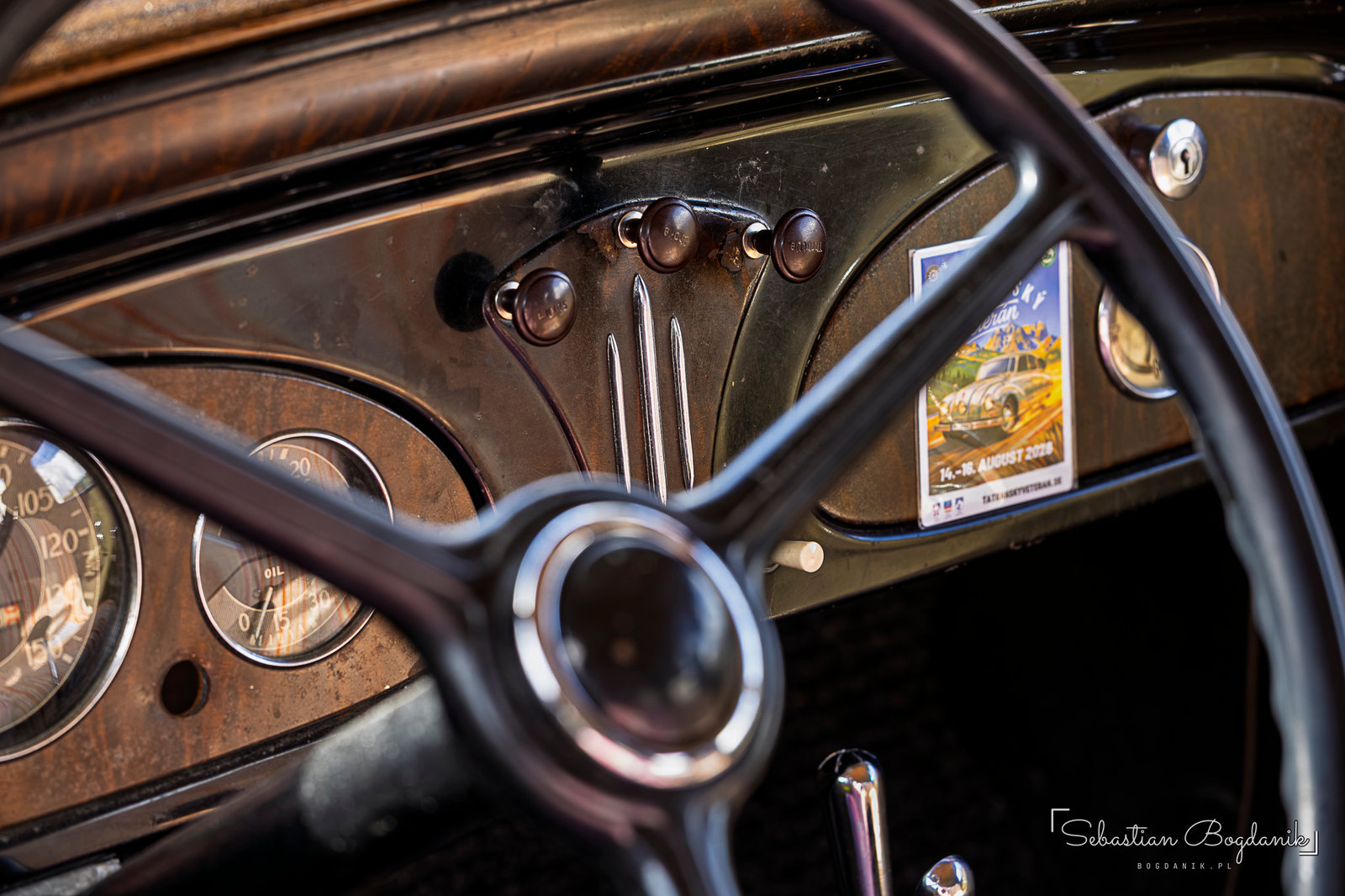 Inside the same Chevy, a wood-grain dash, and on the pillar a pop-out semaphore turn signal from the days before blinkers (1/2)
