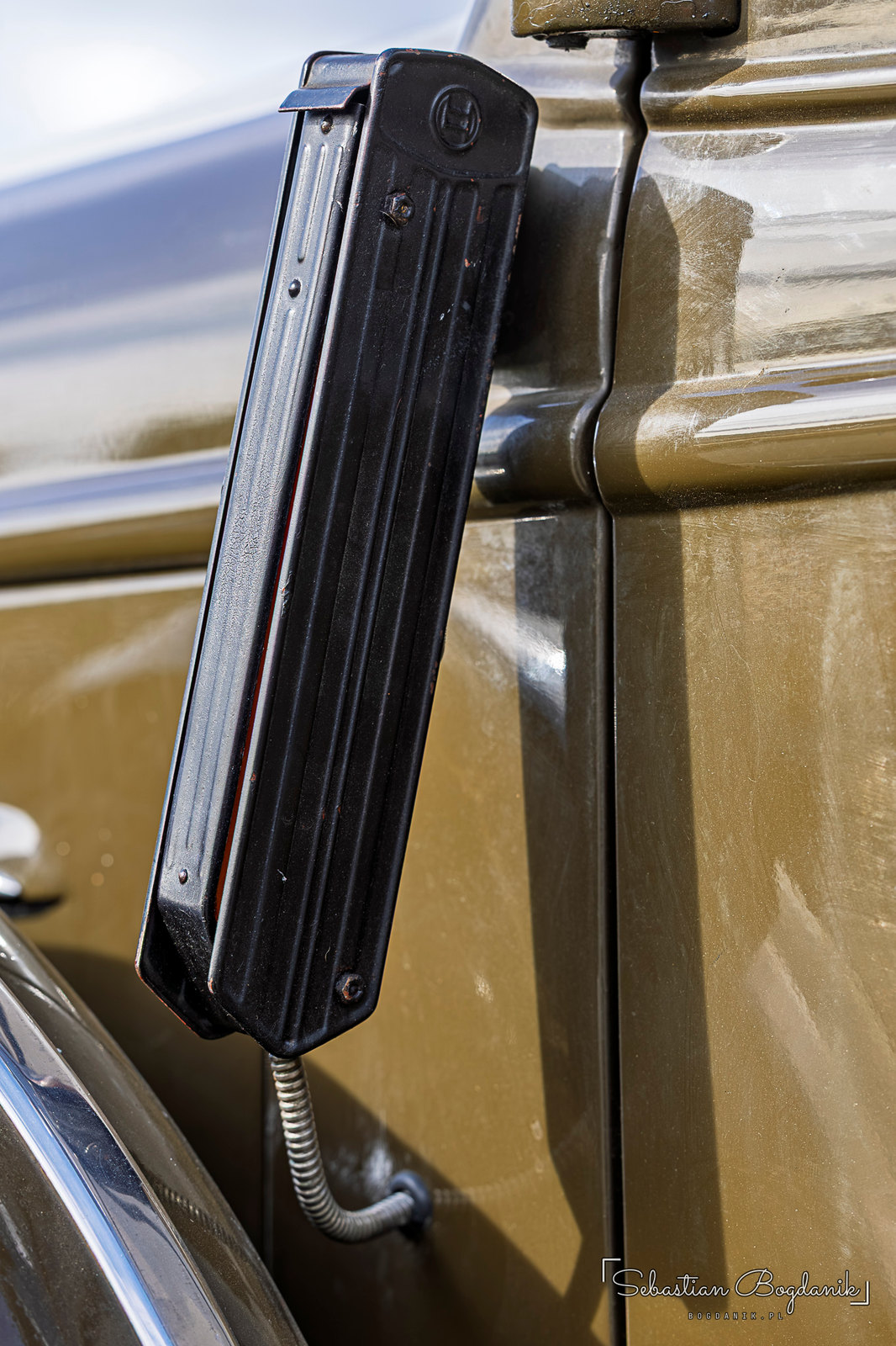 Inside the same Chevy, a wood-grain dash, and on the pillar a pop-out semaphore turn signal from the days before blinkers (2/2)