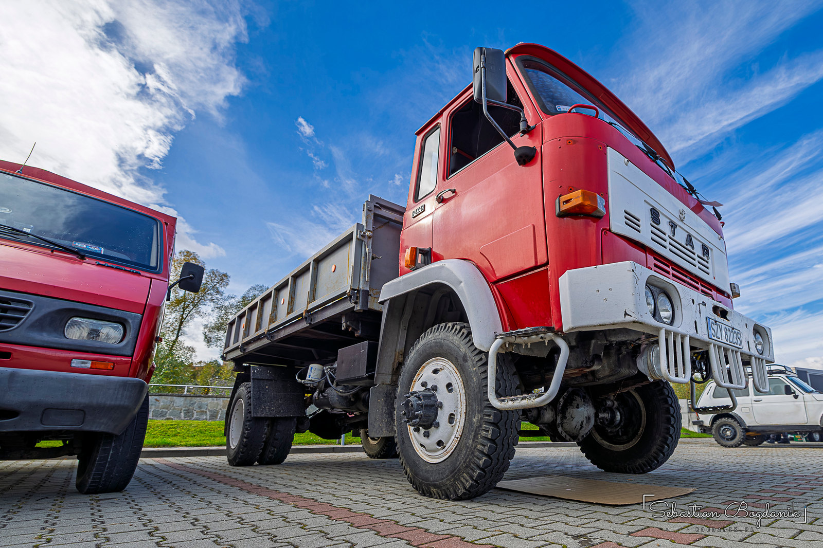 Stars from Starachowice: a red Star dump truck and a military Star 266 wearing number 002 (1/2)