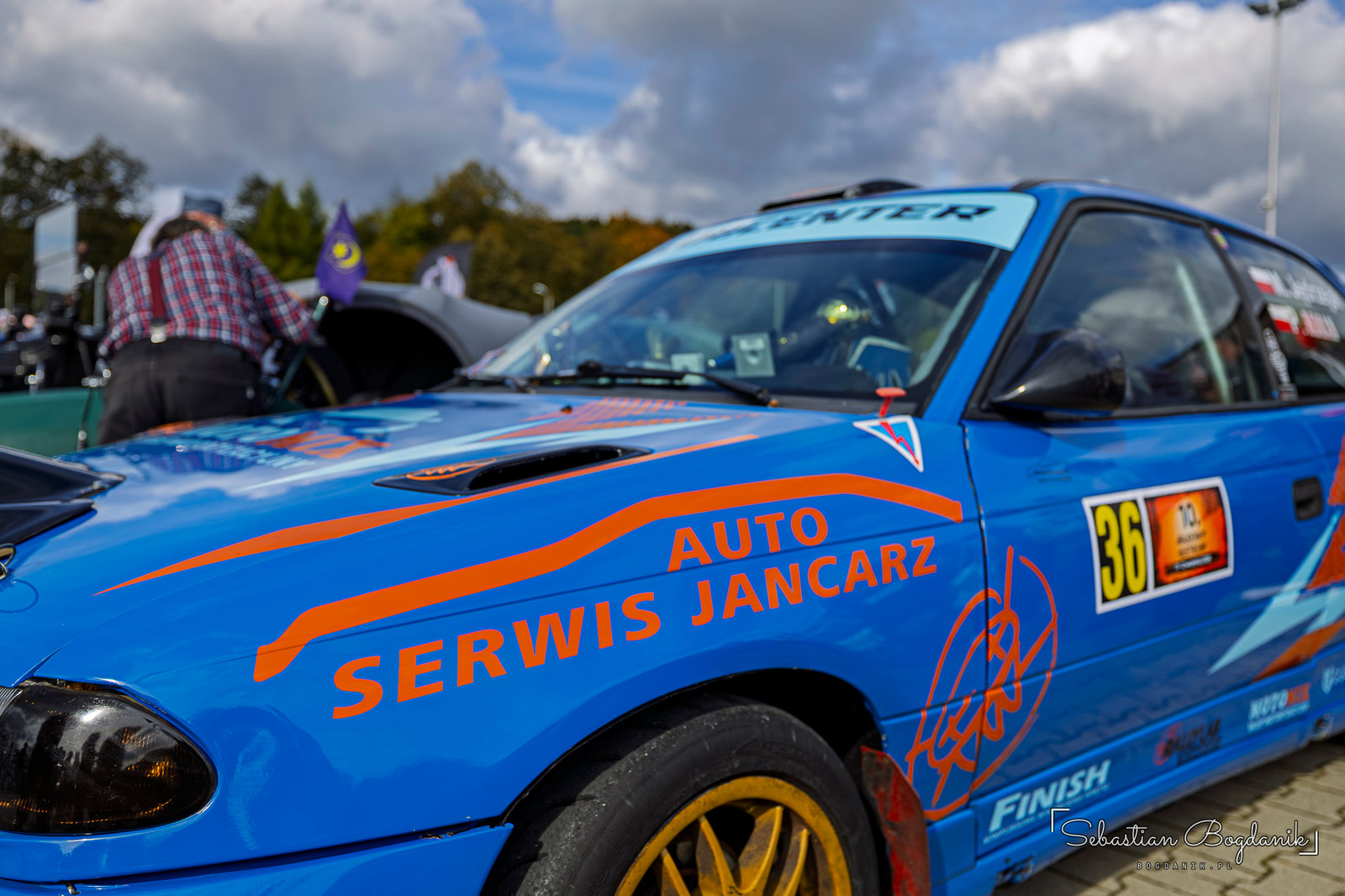 A rally Opel wearing number 36 and a bank of extra lights (1/2)