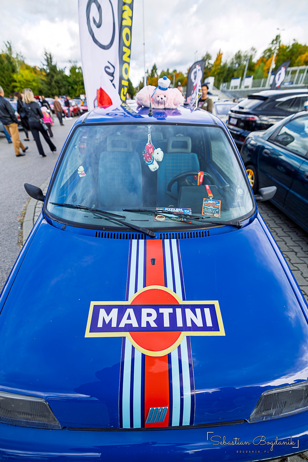 Martini stripes on the hood, the livery that raced on Lancias and Porsches for decades